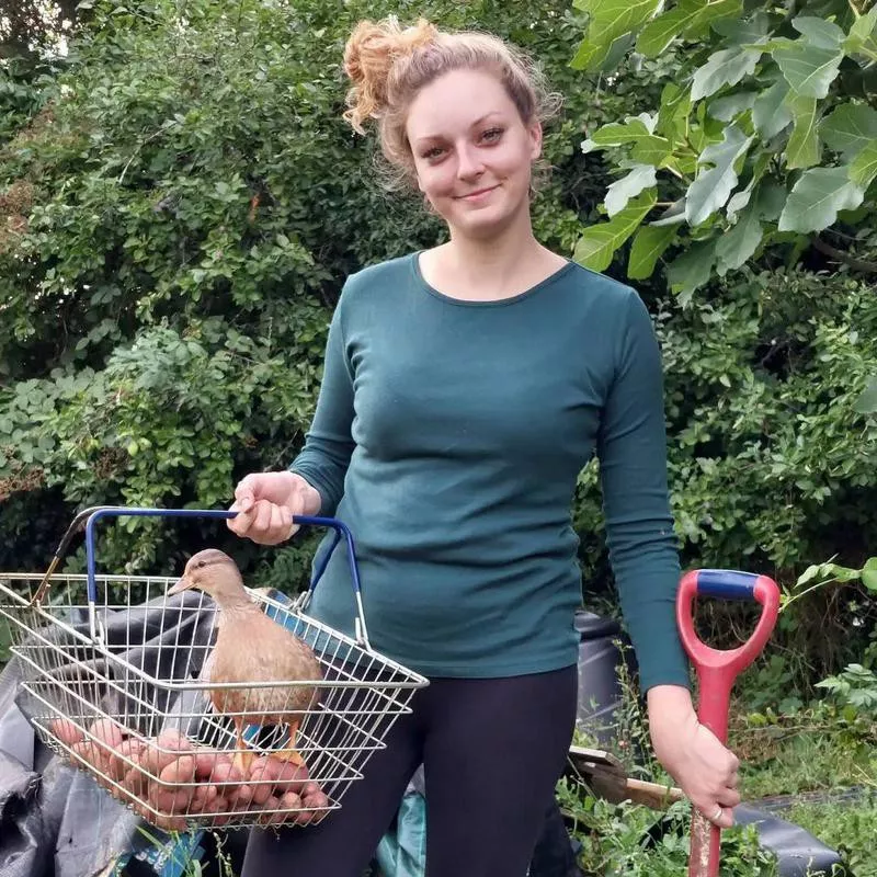 Farmer with pet duck