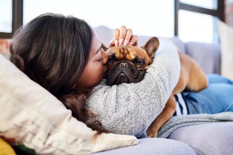 Woman hugging dog