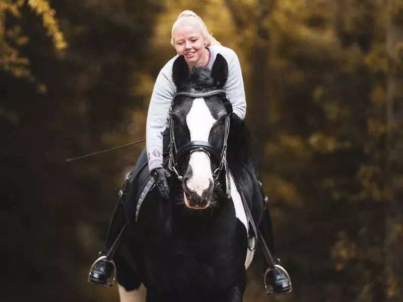 Young showrider and her Drum horse