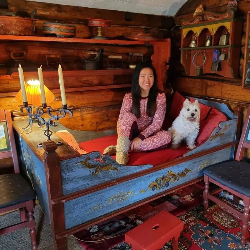 Woman and dog in hotel room