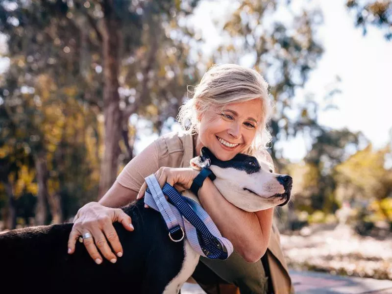 Woman hugging her dog