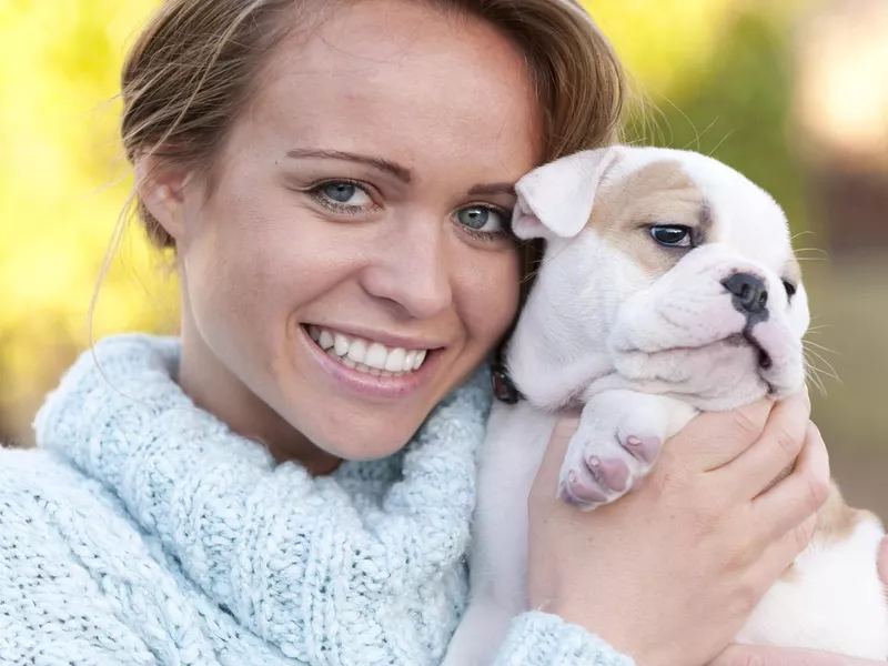 Woman holding her dog