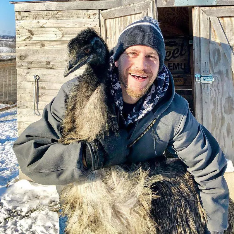 Man with his pet emu