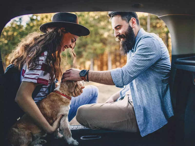 Couple traveling with dog