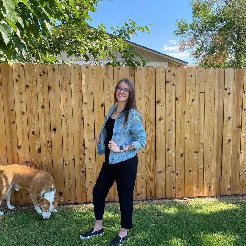 Dog photobombing backyard picture