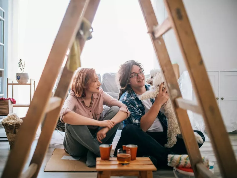 young couple decorating new home