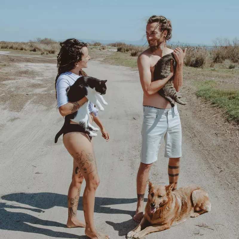 Couple traveling with cats and dogs